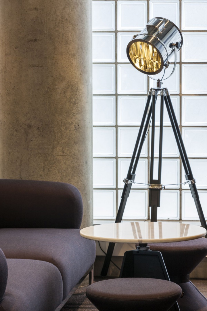 4 - Cafe zone with marble-topped 'Screw' tables and upholstered stools by Tom Dixon.jpg