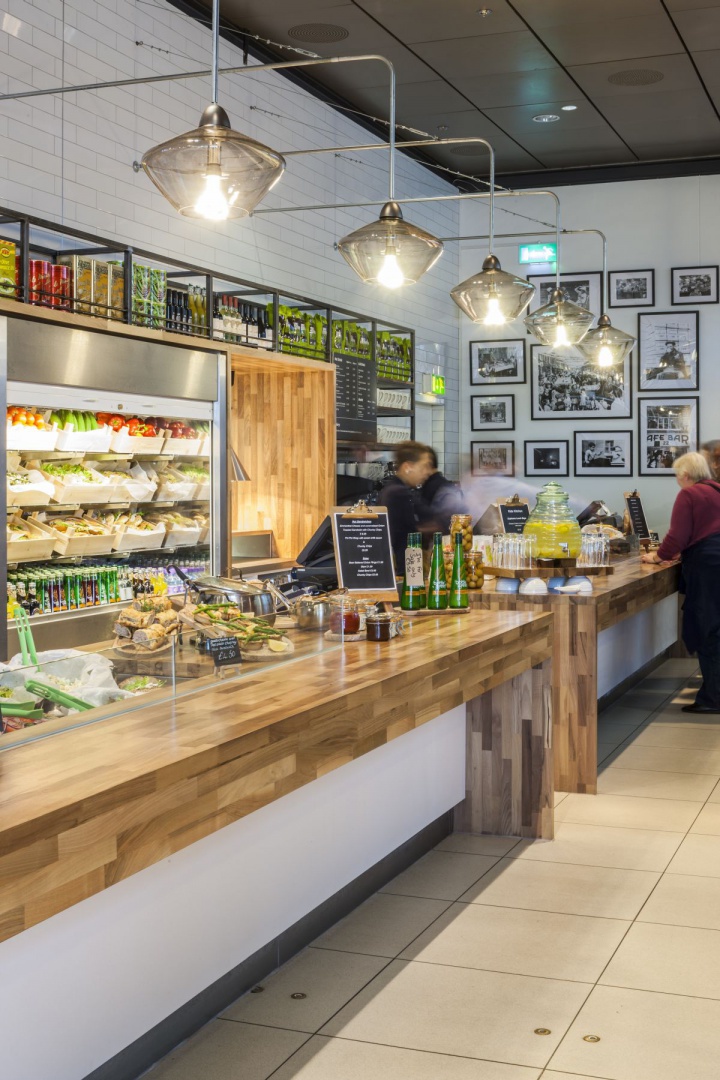 14 - Soren pendant lights light the servery, suspended from bent galvanised metal arms.jpg
